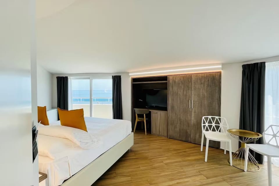 Wake up to sunlit views and a stylish in-room workspace.