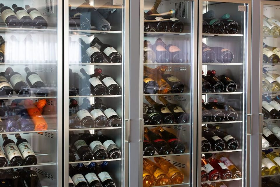 Choose a bottle from the curated wine selection, perfectly chilled.