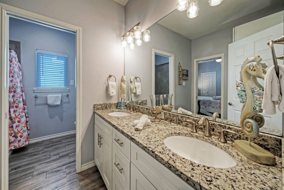 Bathroom 2 features a shower/tub combo.