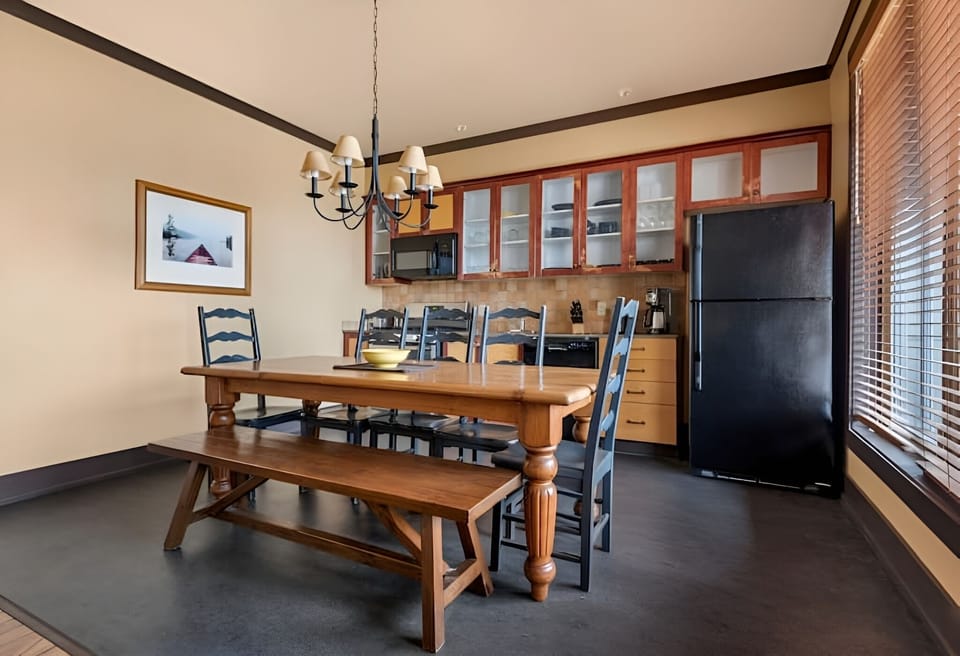 Gather for hearty meals at the rustic table and bench.