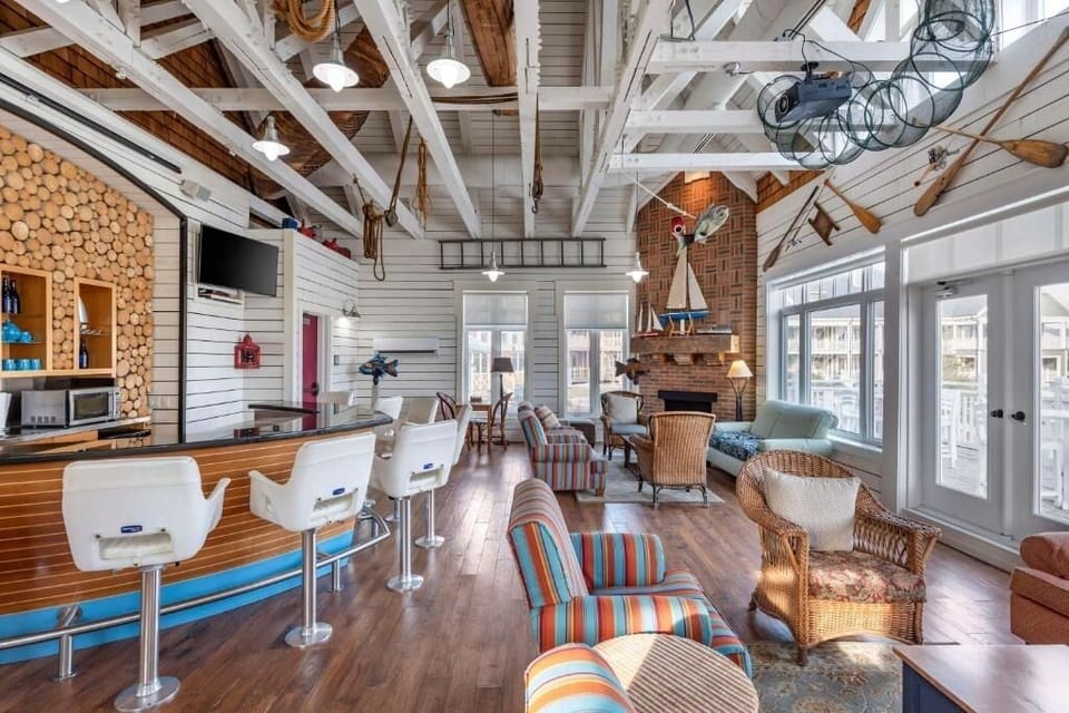 Linger in a lofty lodge lounge with warm nautical charm.