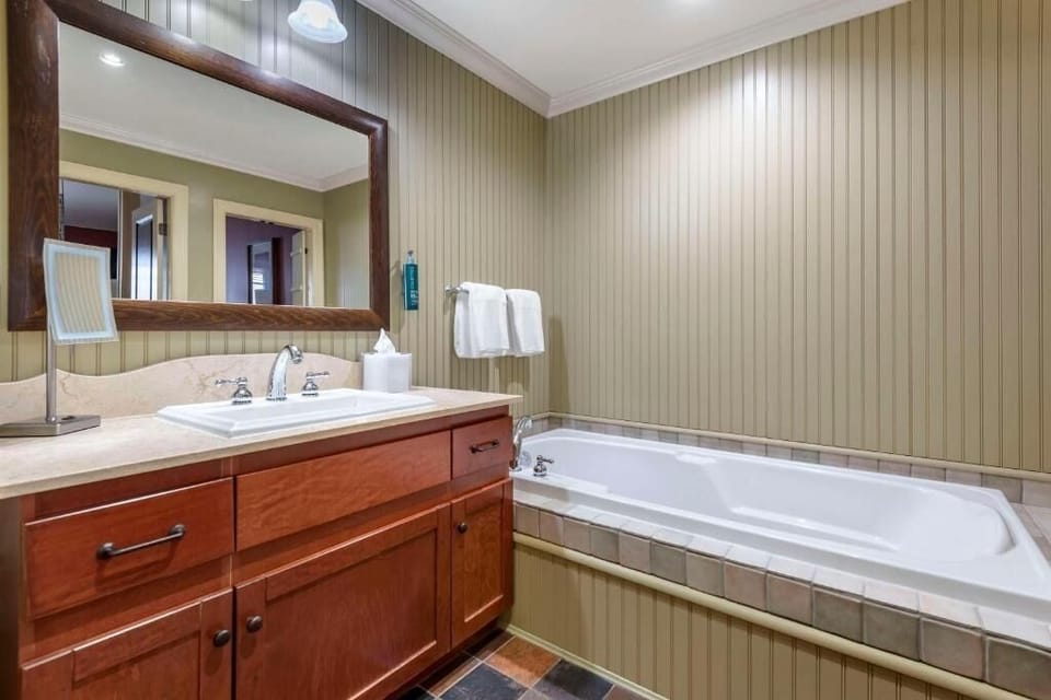 Refresh with a spacious vanity and deep, soothing soaking tub.