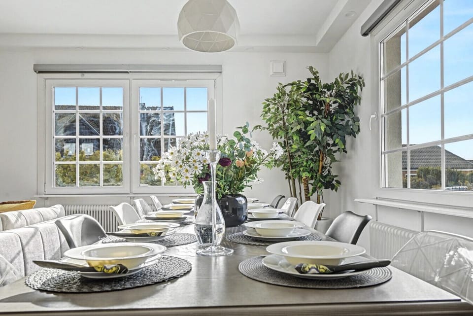 Spacious dining table set for the whole group, ideal for family dinners and spending quality time together.
