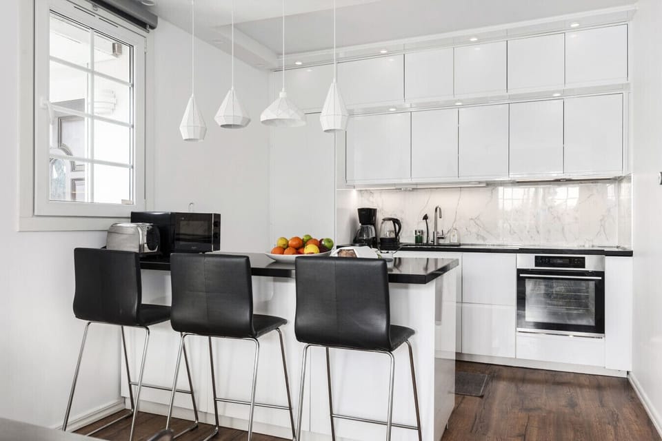 Bright family kitchen with island seating, perfect for preparing meals and enjoying casual dining together.