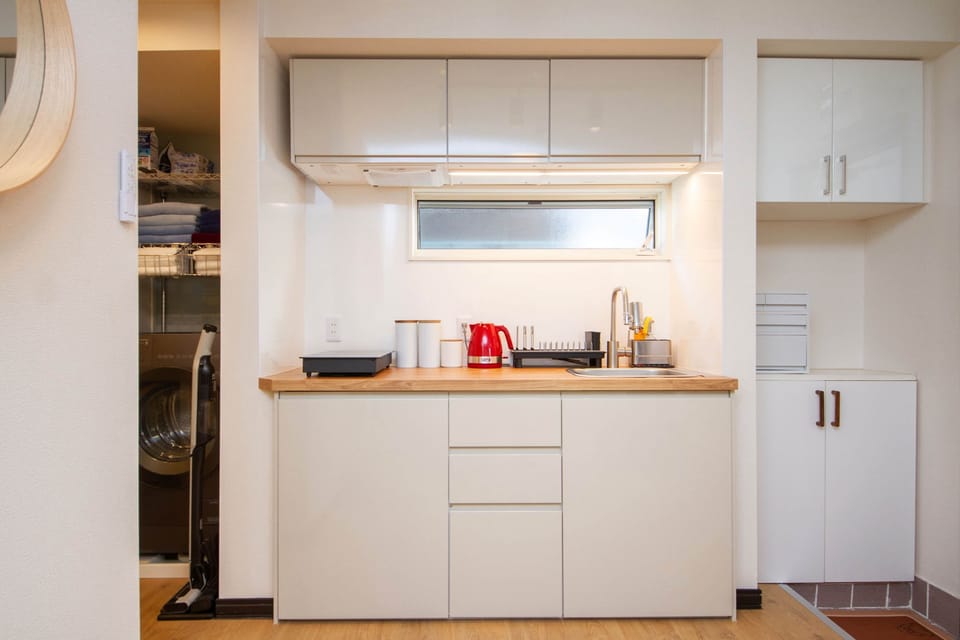 Modern kitchen equipped for simple home cooking.