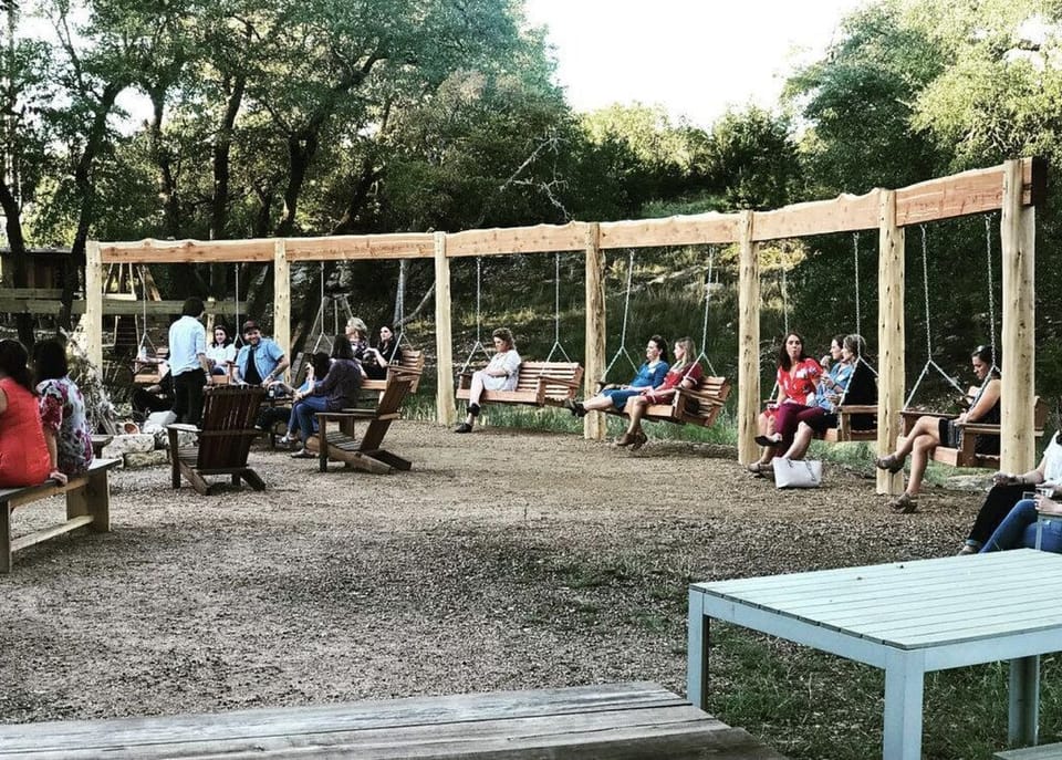 Gather with friends on charming wooden swings