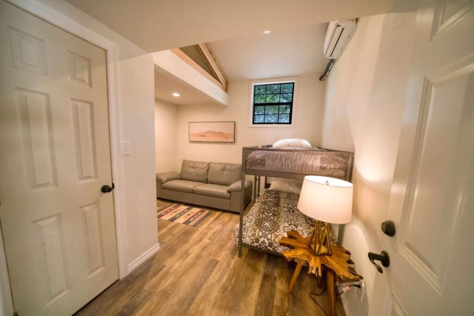 Bedroom four has a twin bunk beds and seating