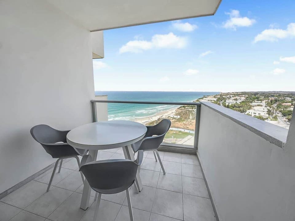 Enjoy effortless alfresco living with a private balcony overlooking the sea.