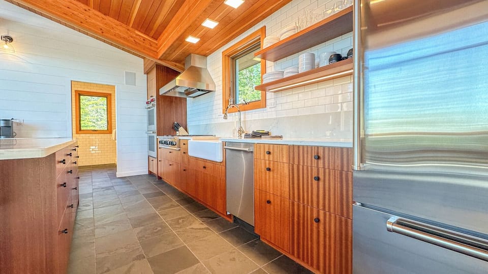 The kitchen has quartz countertops and stainless steel appliances.