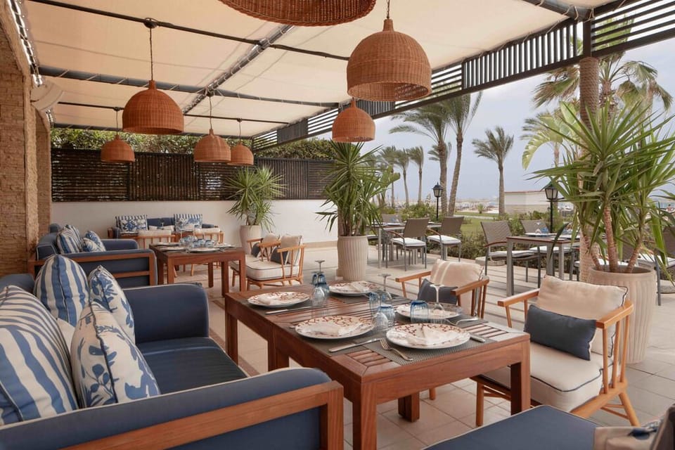 Choose your favorite table in a breezy, sun-dappled dining hall