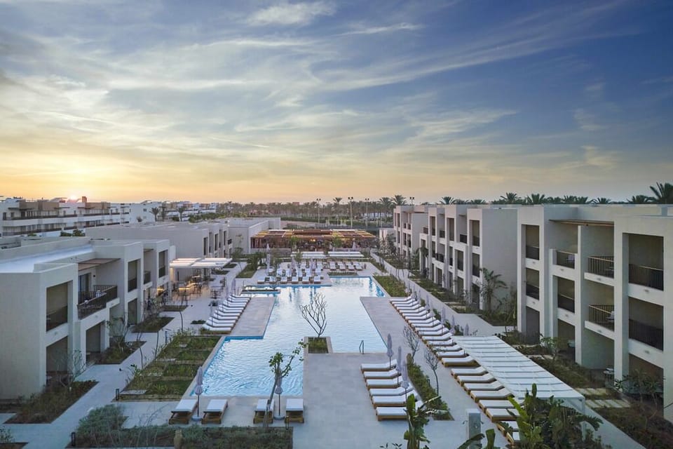 Soak up sunset serenity beside the resort’s expansive pool.