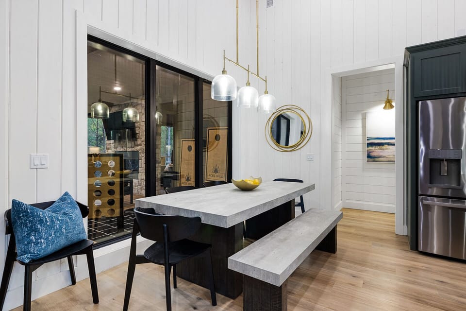 Gather around the elegant dining table for 6–8 or enjoy casual breakfasts at the kitchen bar with seating for 4.


