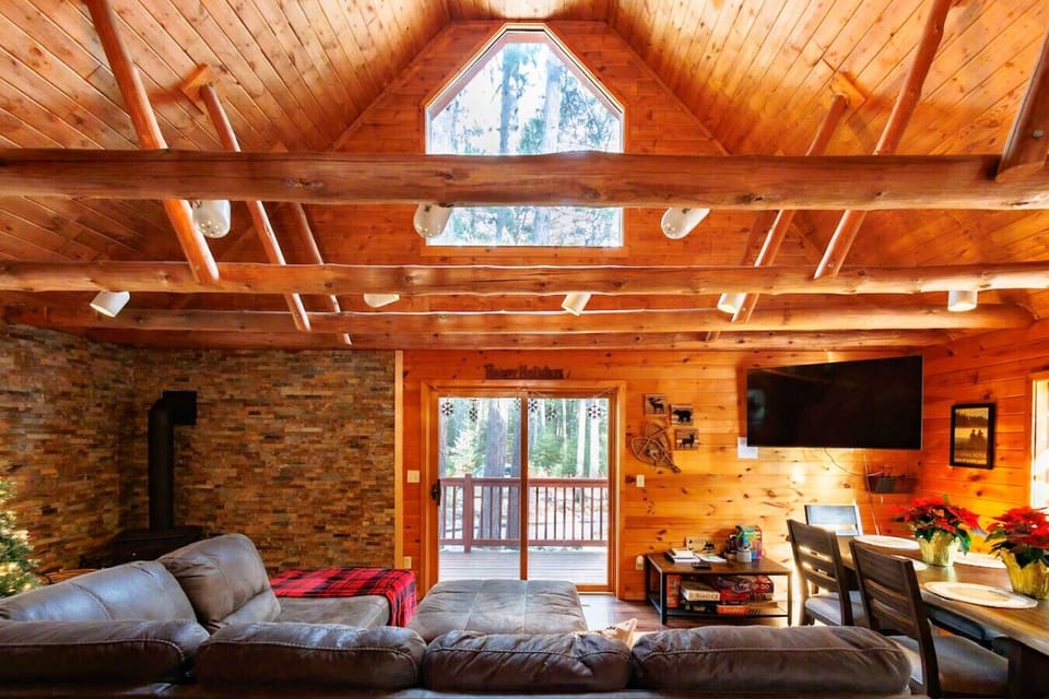 Open Living Room | Gas Fireplace | Great views of the woods | Super comfortable sectional couch w/ Queen sleeper | 50` TV