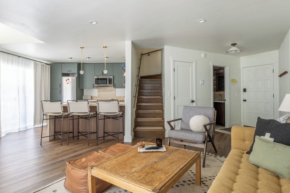 Your open-concept haven flows seamlessly from living to kitchen, perfect for gathering with friends over morning coffee or evening wine.