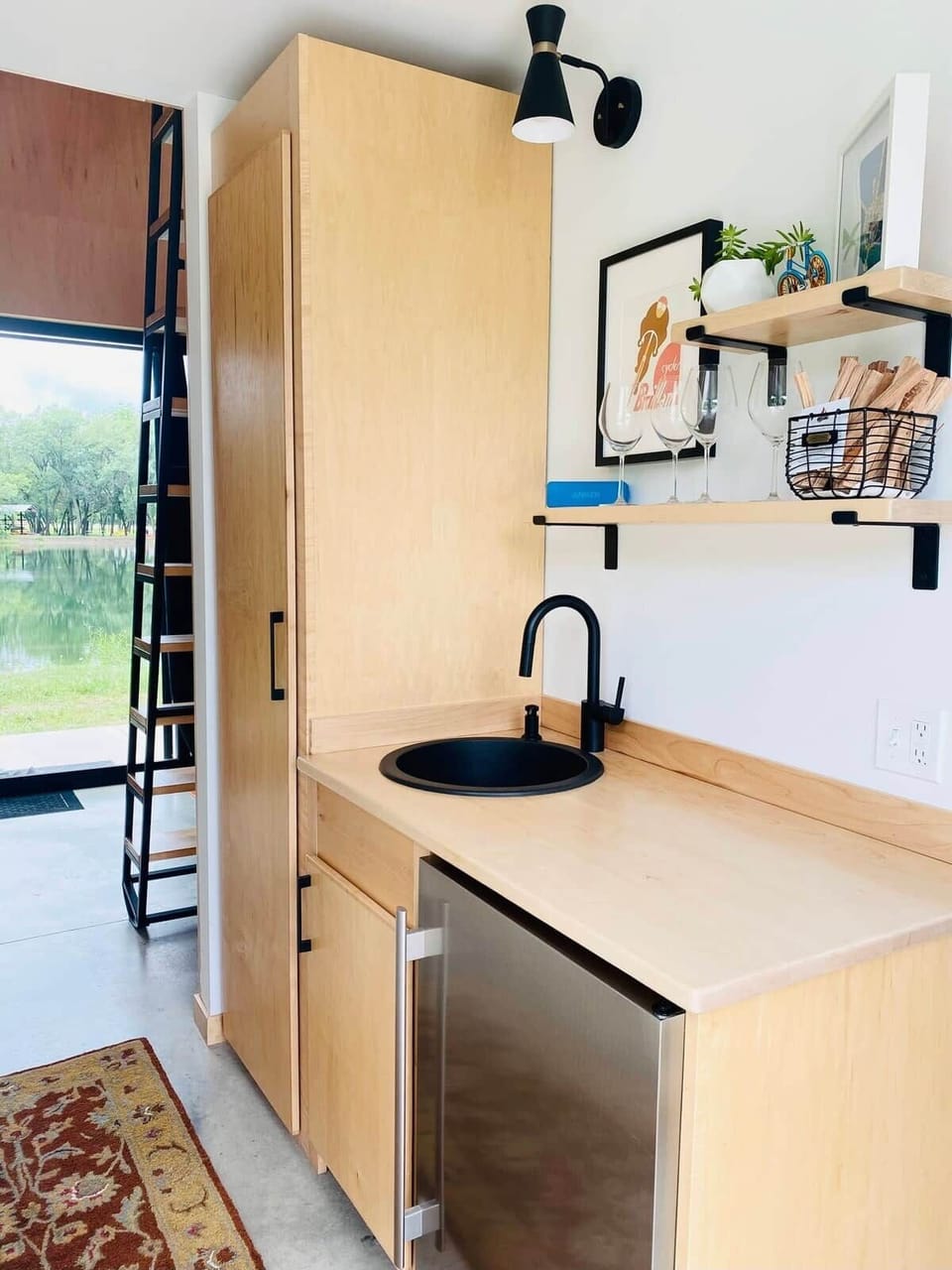 Kitchenette features:
- Microwave
- Hot plate
- Pots & Pans
- Coffeemaker 
- Electric Kettle & French Press
- Toaster
- Mini fridge
- Cutlery
- Charcoal & lighter fluid
- Bluetooth speaker 
- Cooking utensils 
