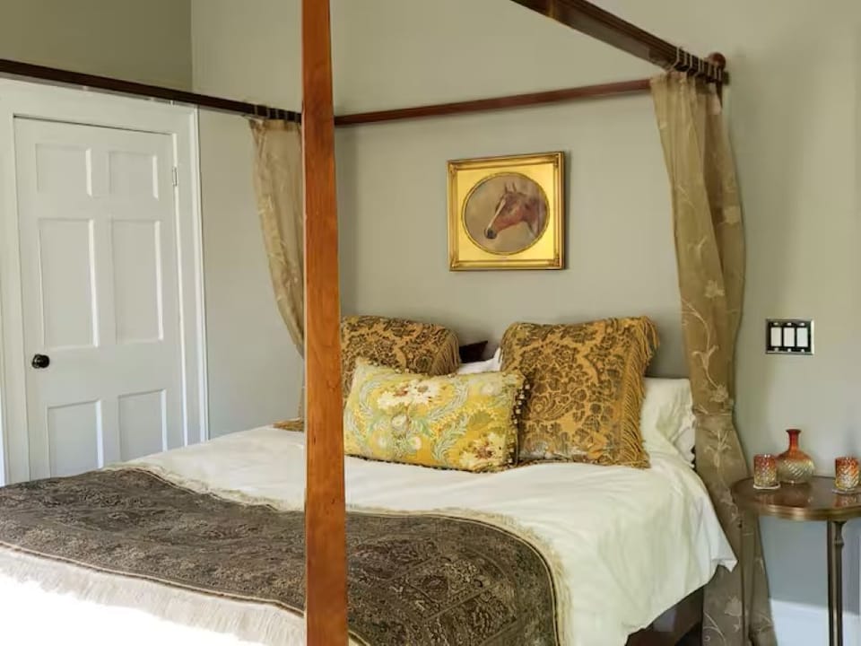 King canopy bed with silk organza draperies, silk qum runner, Yves Delorme sheet