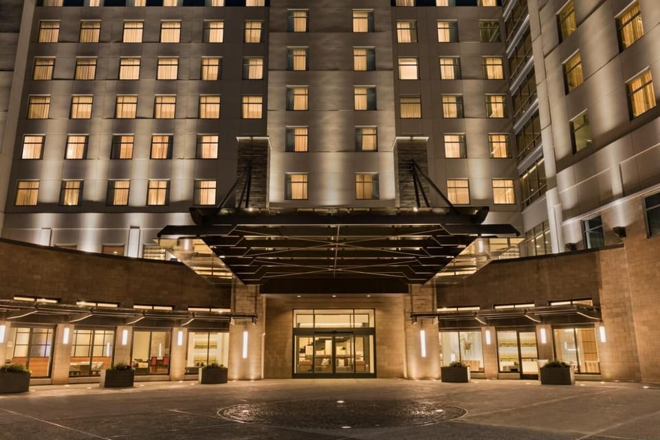 Arrive in style beneath the beautifully lit grand entrance.