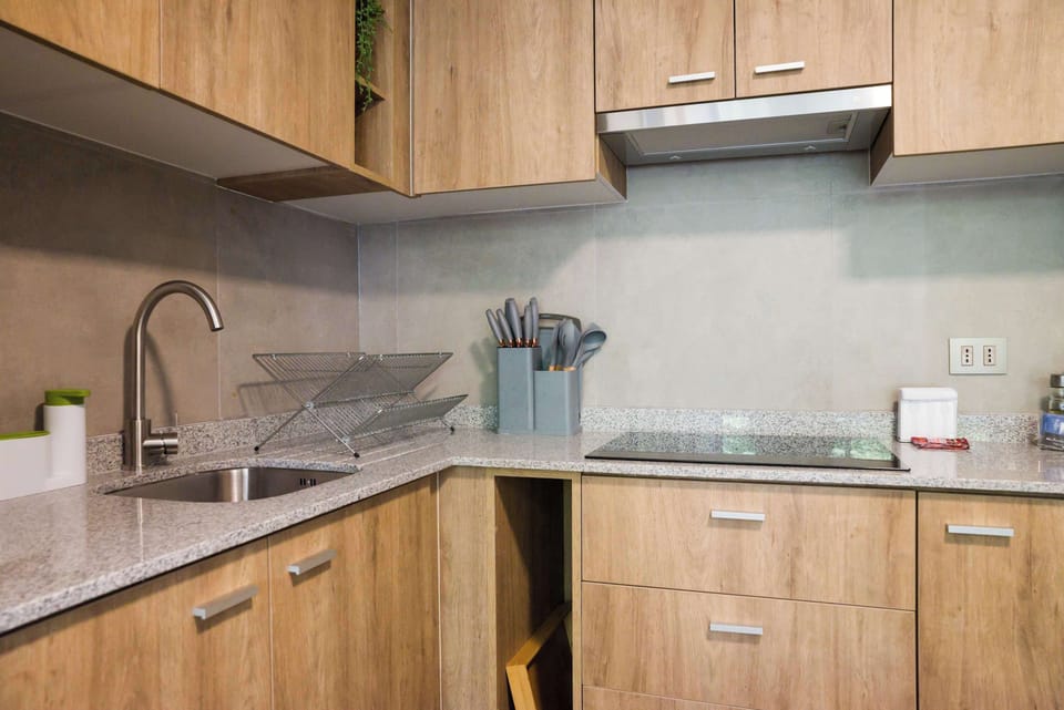 Sleek and modern kitchen with all essentials for a comfortable stay in the heart of Chile.