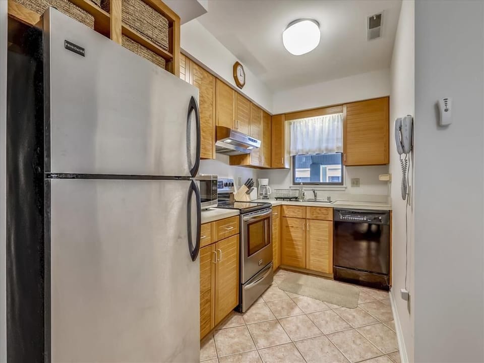 Cook up a storm in the well-equipped kitchen, featuring modern appliances and plenty of counter space.