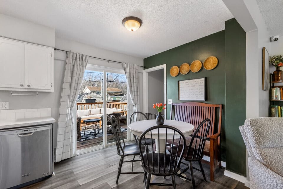 The sliding doors inviting you from cozy breakfast conversations to sun-soaked moments on the deck. It’s the kind of space where coffee lingers and evenings stretch a little longer.