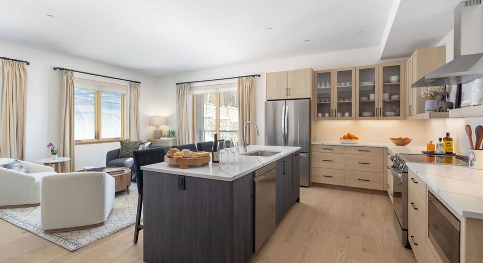 The fully equipped kitchen features generous counter space and modern appliances, perfect for preparing meals for large groups.