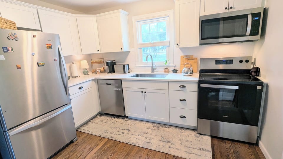 Kitchen: Bright, fully stocked kitchen with Keurig, bakeware & kettle