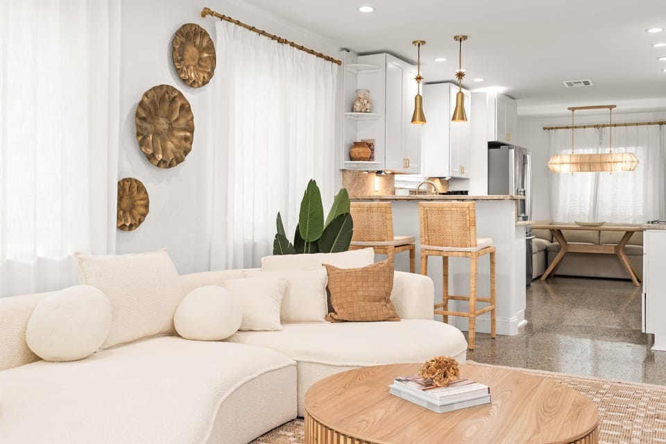 Bright, airy living space designed for effortless relaxation.  Sink into the plush curved sofa and unwind after a day of adventure.