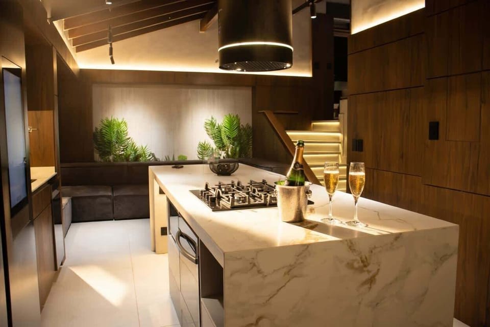 Kitchen: Culinary paradise with sleek marble counters and tropical views, perfect for gourmet adventures!