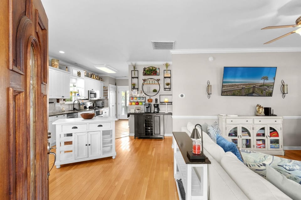 Bright open living room and kitchen with modern farmhouse charm