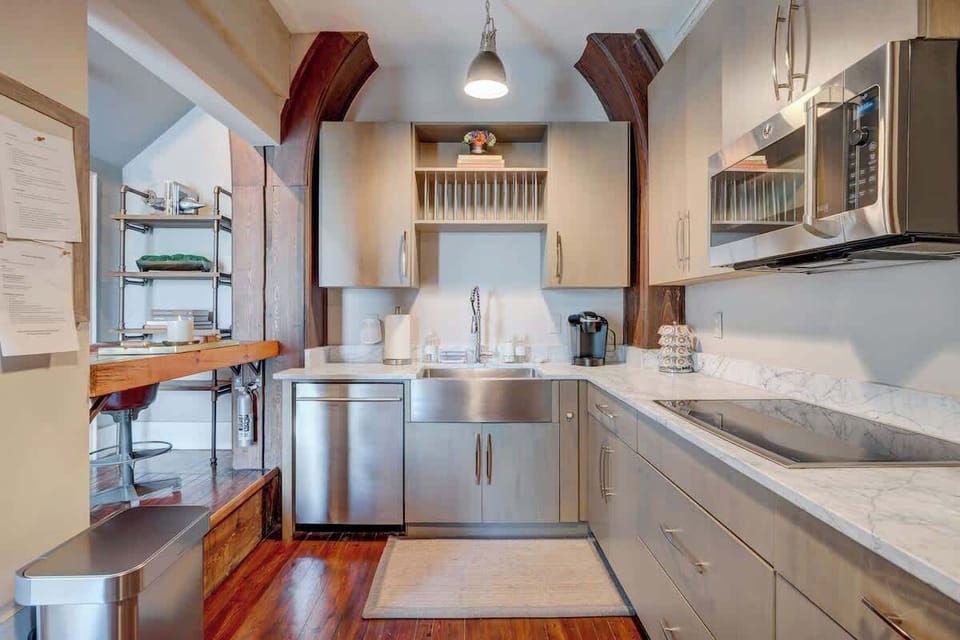 Charming Kitchen: Whip up culinary delights in this stylish, fully equipped kitchen with wooden accents!