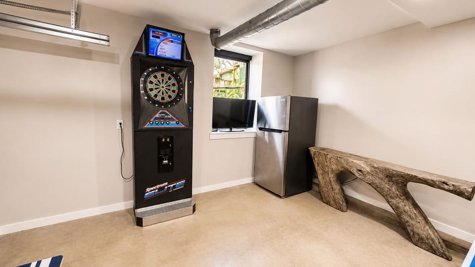 -Car Garage or Game Room - Your choice. Enjoy plenty of space to park 2 vehicles inside or use this space for the ultimate game room complete with Ping Pong Table, Arcade Dart Machine, Putting Challenge Game, and (2) Cornhole Games.