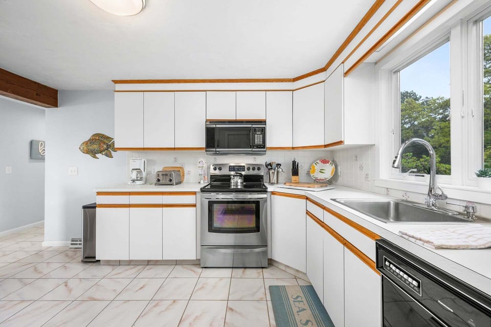 Fully equipped kitchen featuring  stainless steel appliances