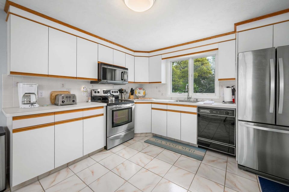 Roomy, well-equipped kitchen, perfect for preparing meals with family and friends.