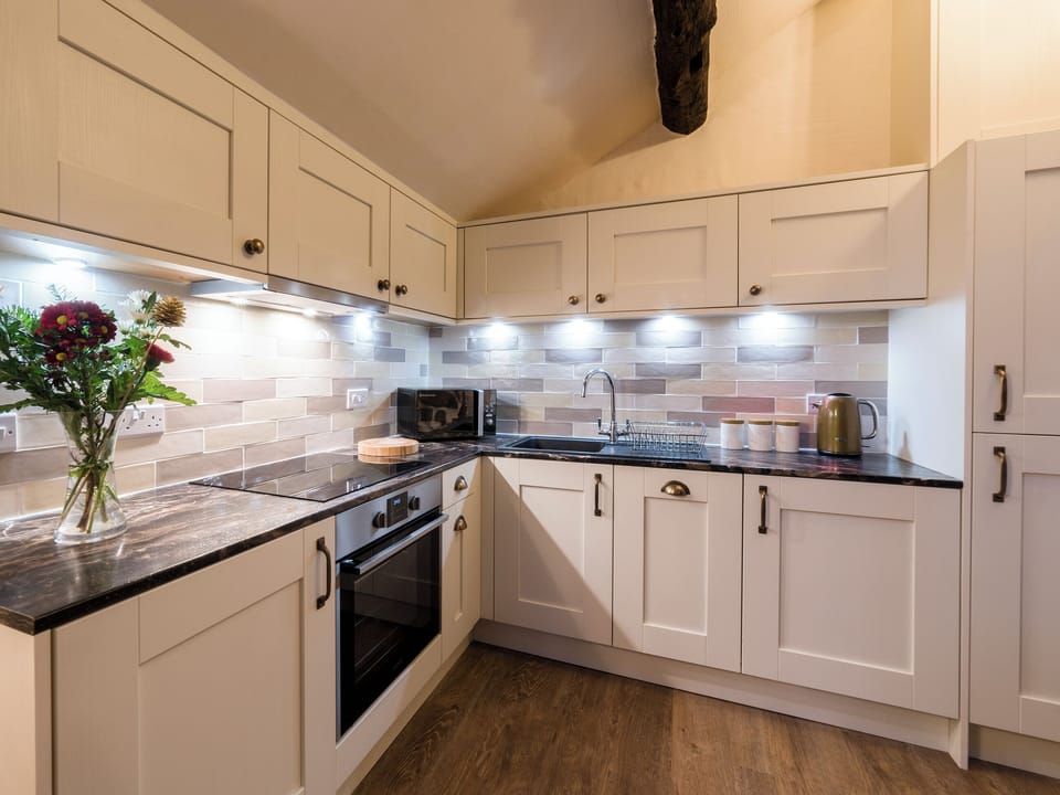 Well-equipped kitchen with dining area | Stanley Ghyll Cottage - Bridge End Farm Cottages, Boot, near Eskdale