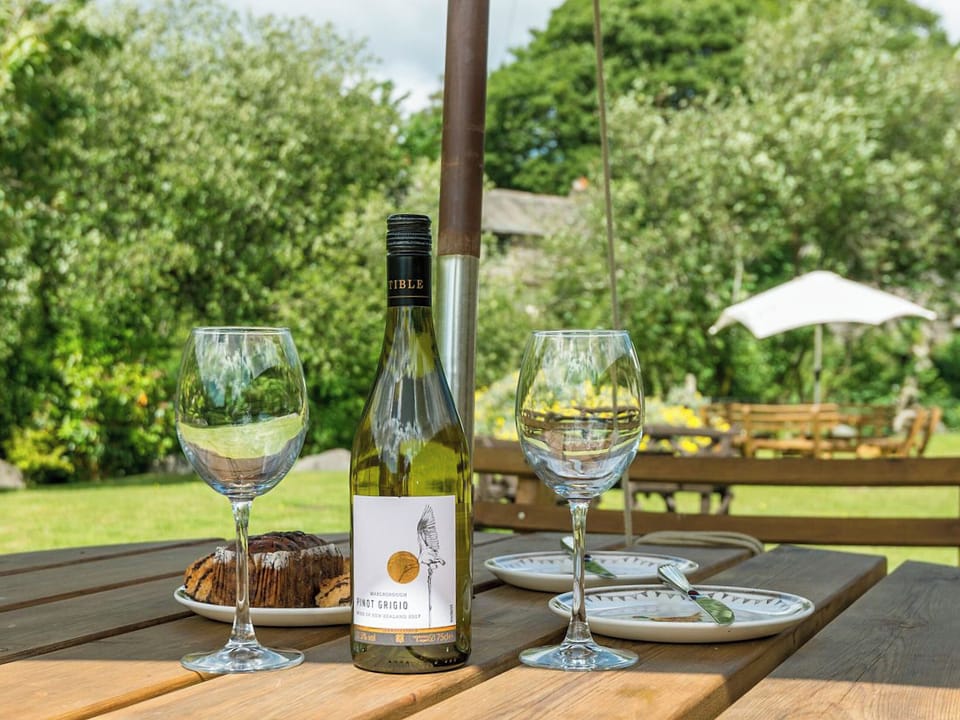 Shared sitting-out-area with furniture | Wastwater Cottage - Bridge End Farm Cottages, Boot, near Eskdale