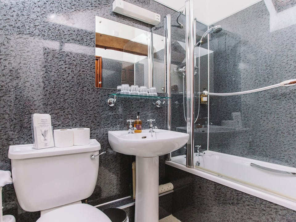 Family bathroom with shower over bath | Gelt Cottage, Castle Carrock, near Brampton