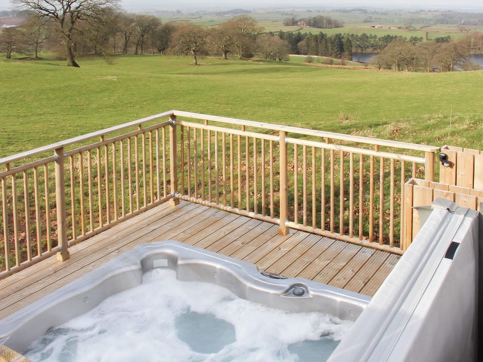 Relax in the invigorating hot tub and admire the view | Gelt Cottage, Castle Carrock, near Brampton