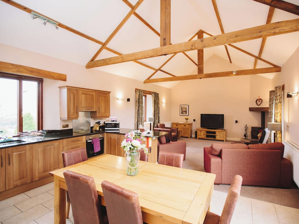 Exposed wooden trusses in living areas | Watson Cottage, Castle Carrock, near Brampton