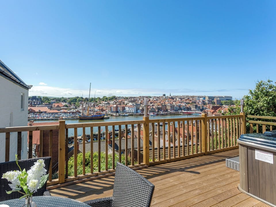 Fantastic decking area with hot tub, sitting out area and wonderful views | The Ropery - Cyana Cottages, Whitby