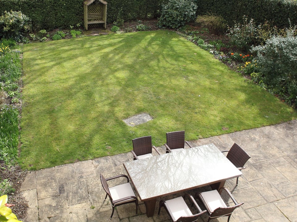 Enclosed garden with patio | Goodwood - Bruern Holiday Cottages, Bruern, near Chipping Norton