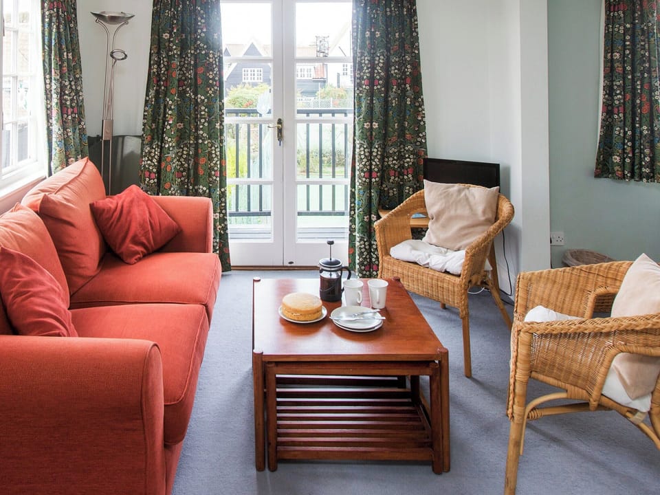 Living area with balcony access | 1 Bell Lodge, Thorpeness, near Aldeburgh