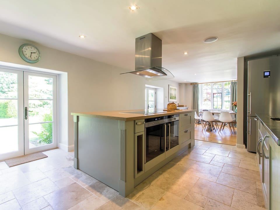 Delightful kitchen with French doors to the patio | The Dairy House, Illminster