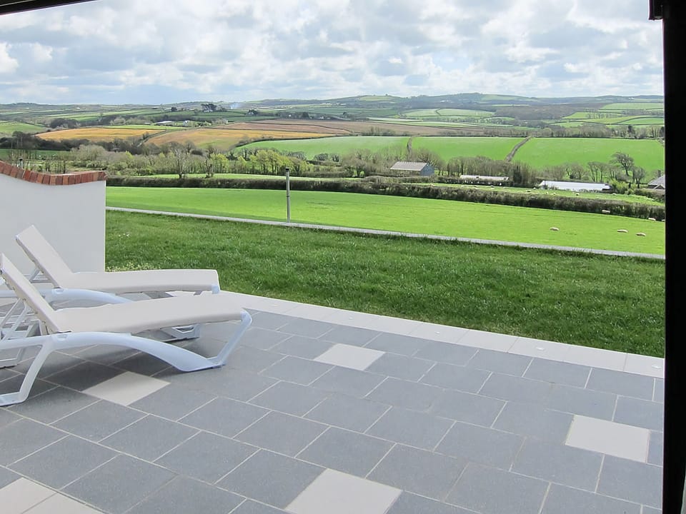 Wonderful far reaching view from your own private patio | Shooting Star - Wooldown Holiday Cottages, Marhamchurch, near Bude