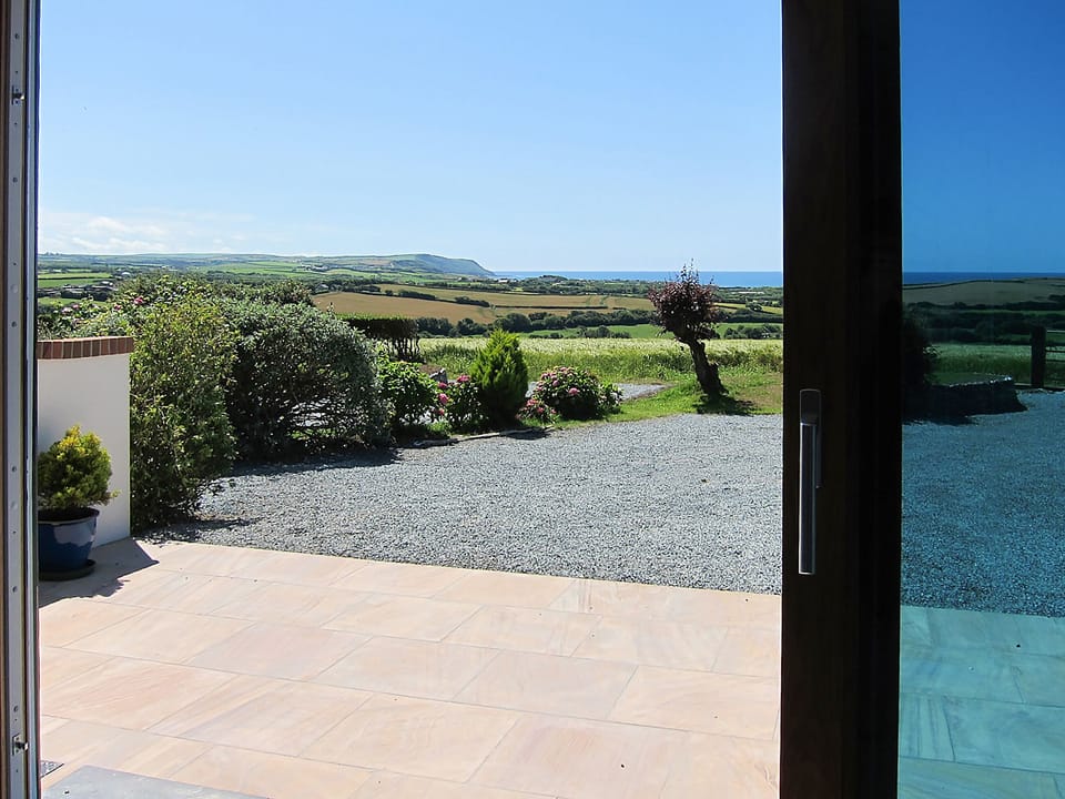 Wonderful far reaching view from your own private patio | Bijou - Wooldown Holiday Cottages, Marhamchurch, near Bude