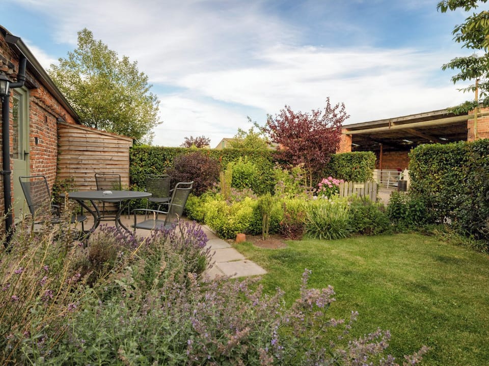 Garden with patio | The Hayloft - Mackinder Farms, Brayton, Selby