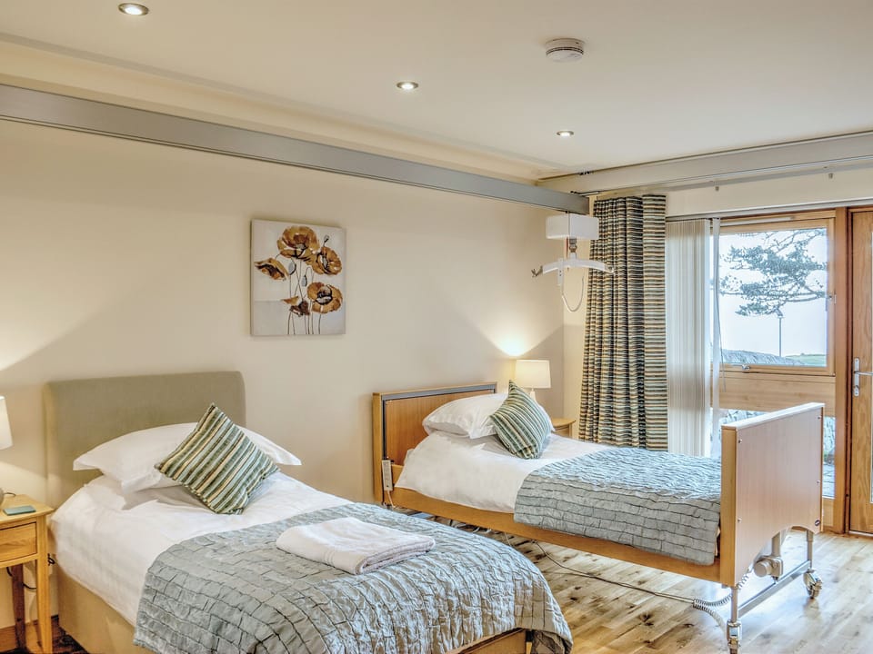 The twin bedded room is well furnished and decorated to a high standard | , 