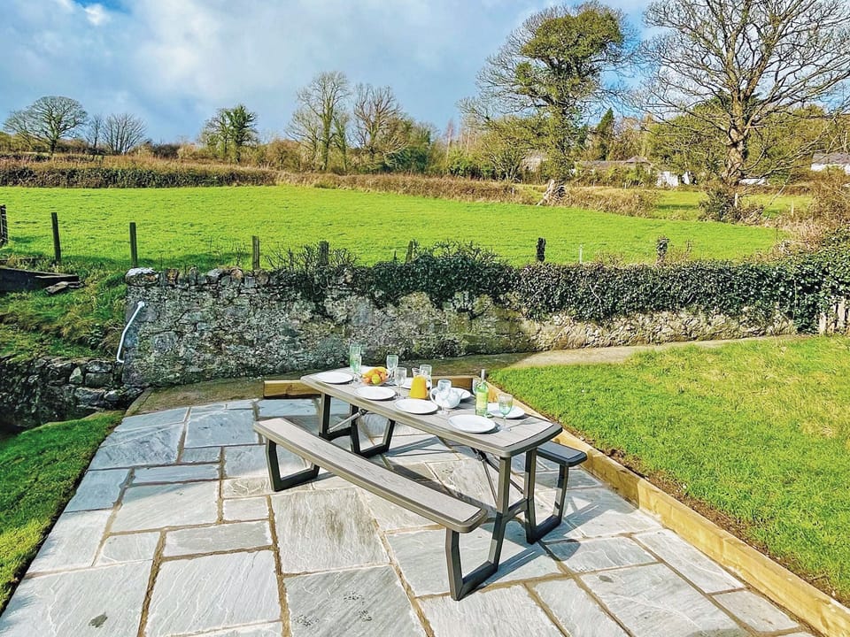 Picnic table and benches in garden (seats 8) | Bay View, Beaumaris