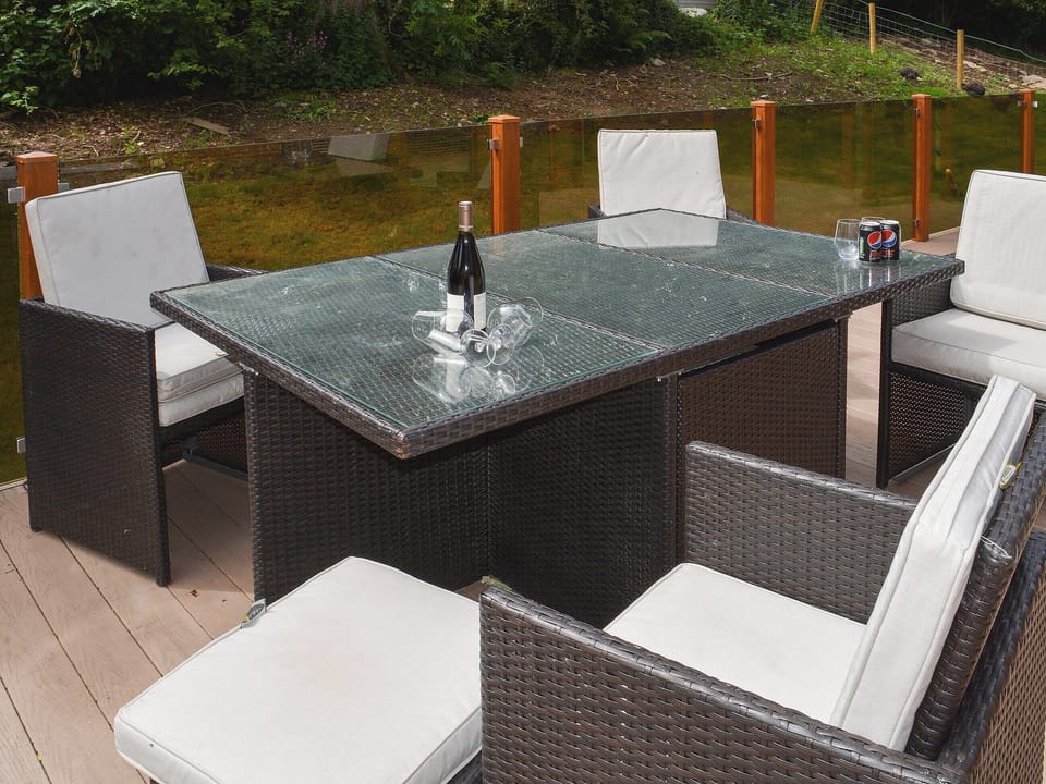 Enjoy an alfresco meal on the decking | Ysgubor FadogEin Yfory, Brynteg, near Benllech
