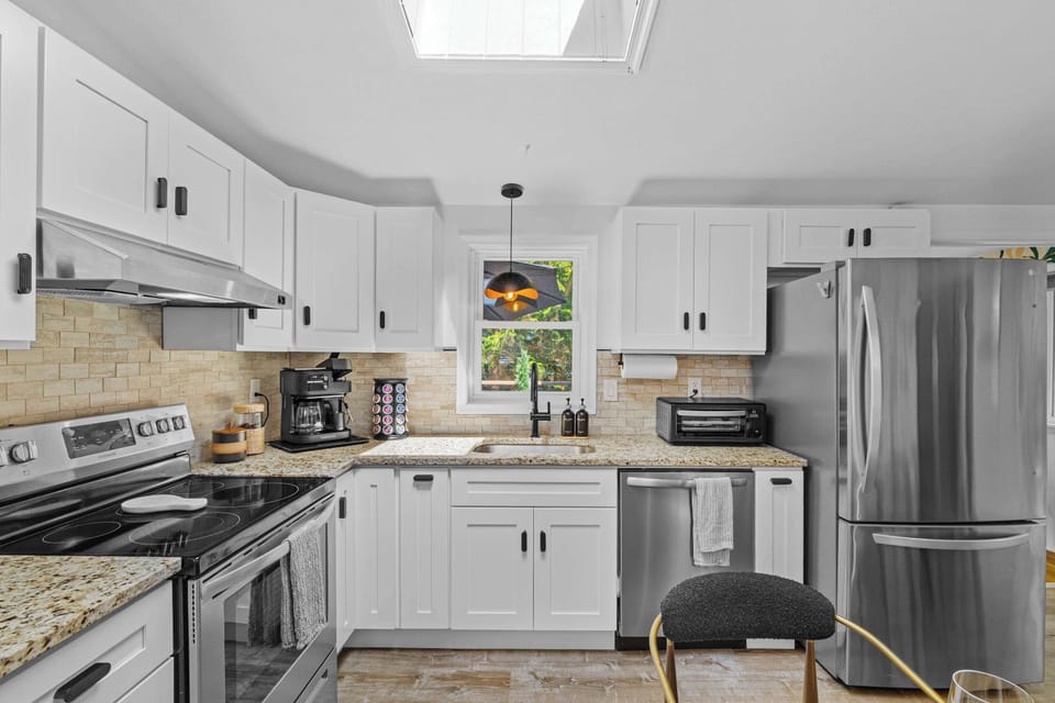  Fully stocked kitchen with modern appliances and plenty of counter space for preparing meals.