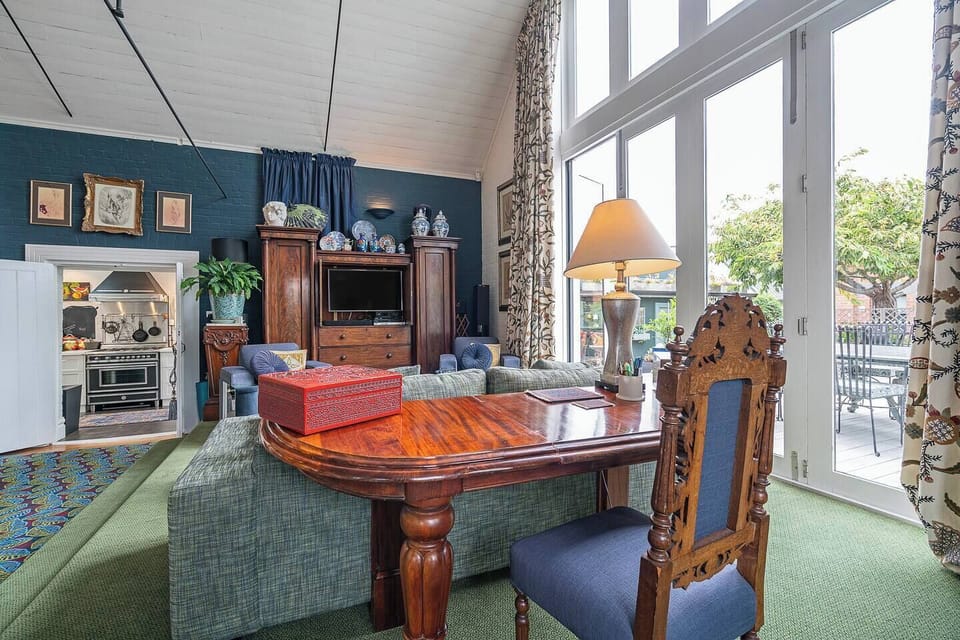 Set up at the dedicated workspace by the window, a light-filled corner ideal for catching up on emails with Wi-Fi throughout the home.